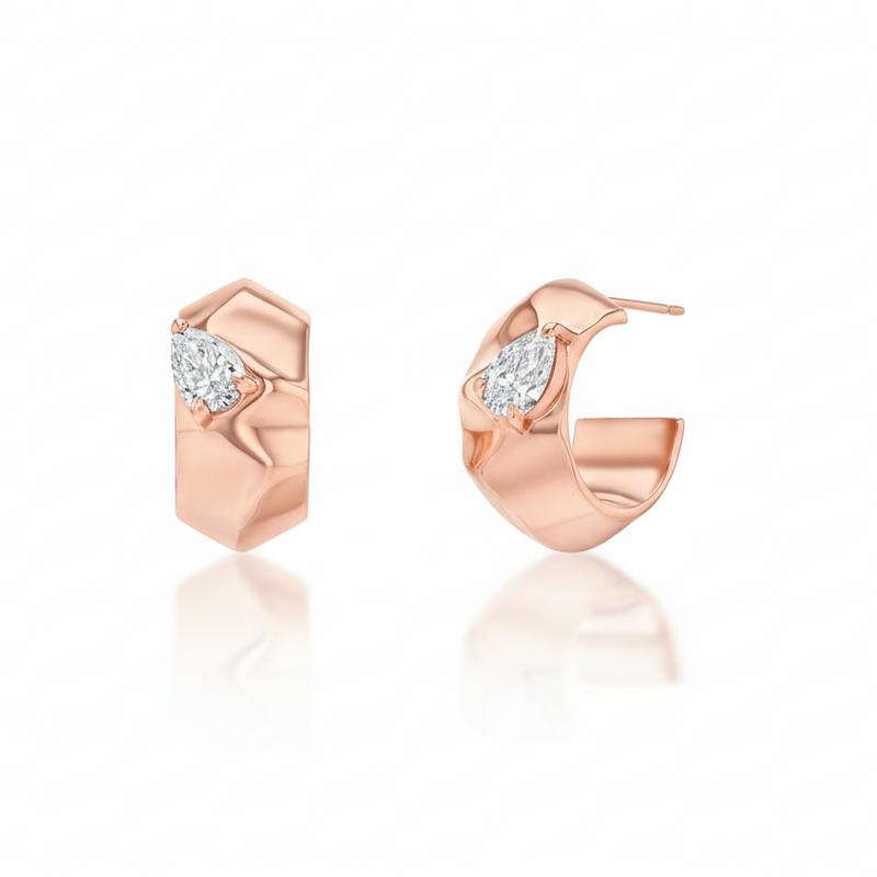 Gold hoop earrings with diamond accents on a white background