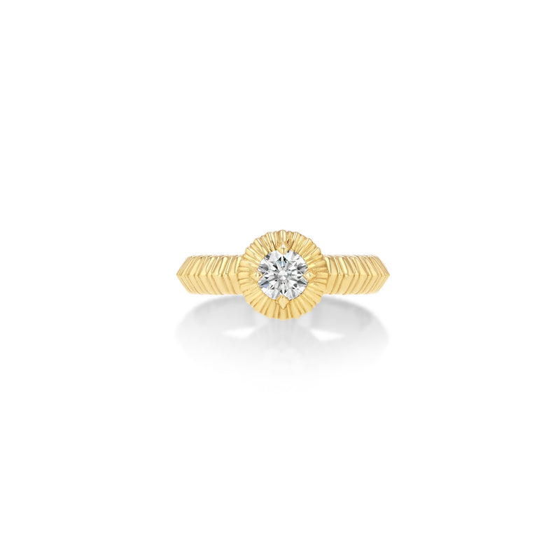 Gold ring with a diamond on a white background