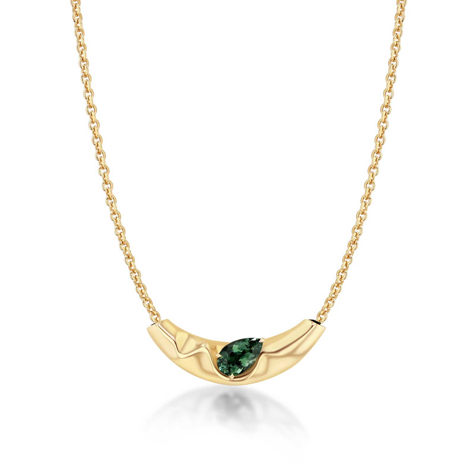 Gold necklace with a green gemstone on a white background