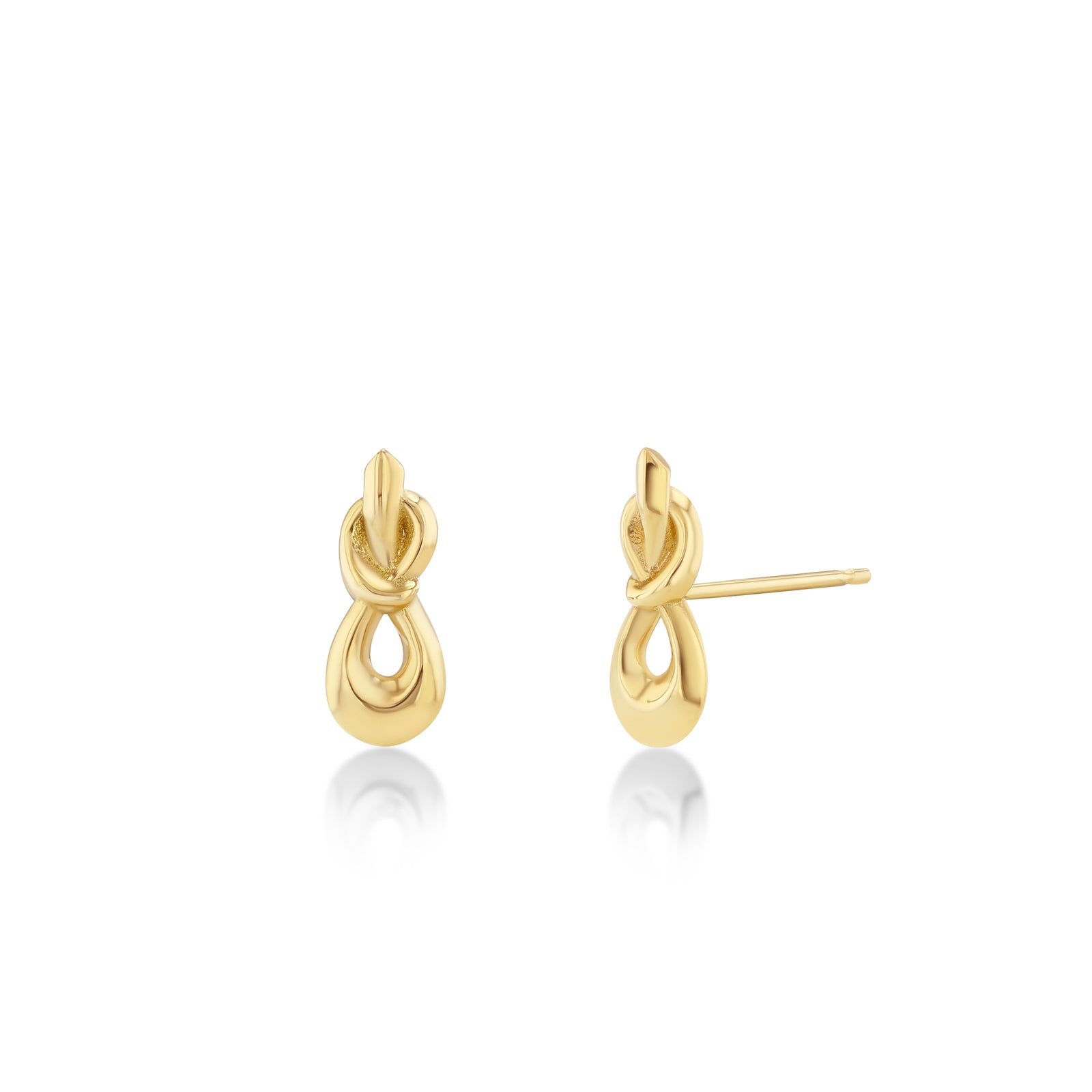 Pair of gold earrings on a white background