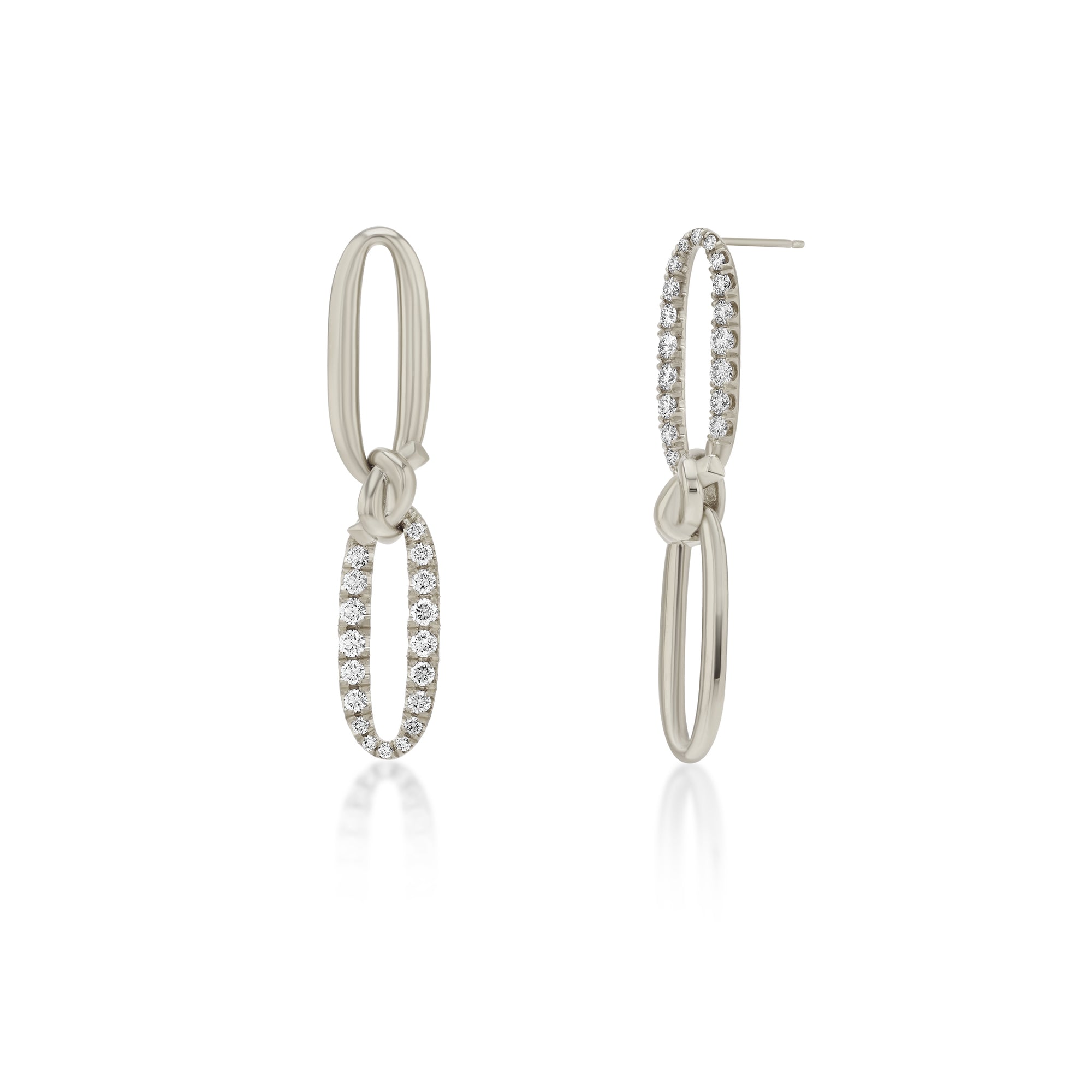 Pair of white gold hoop earrings with diamond accents on a white background