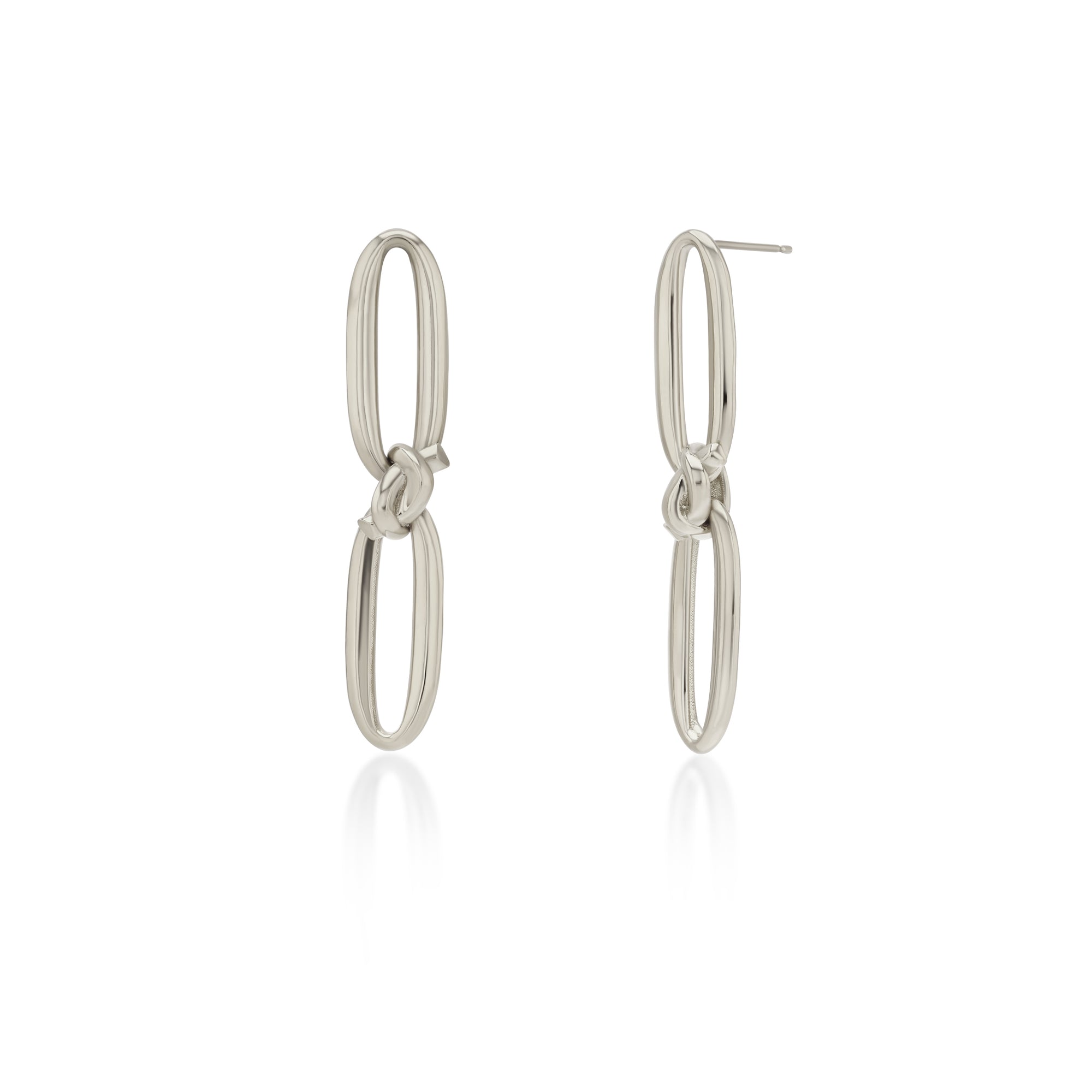 White Gold earrings on white background