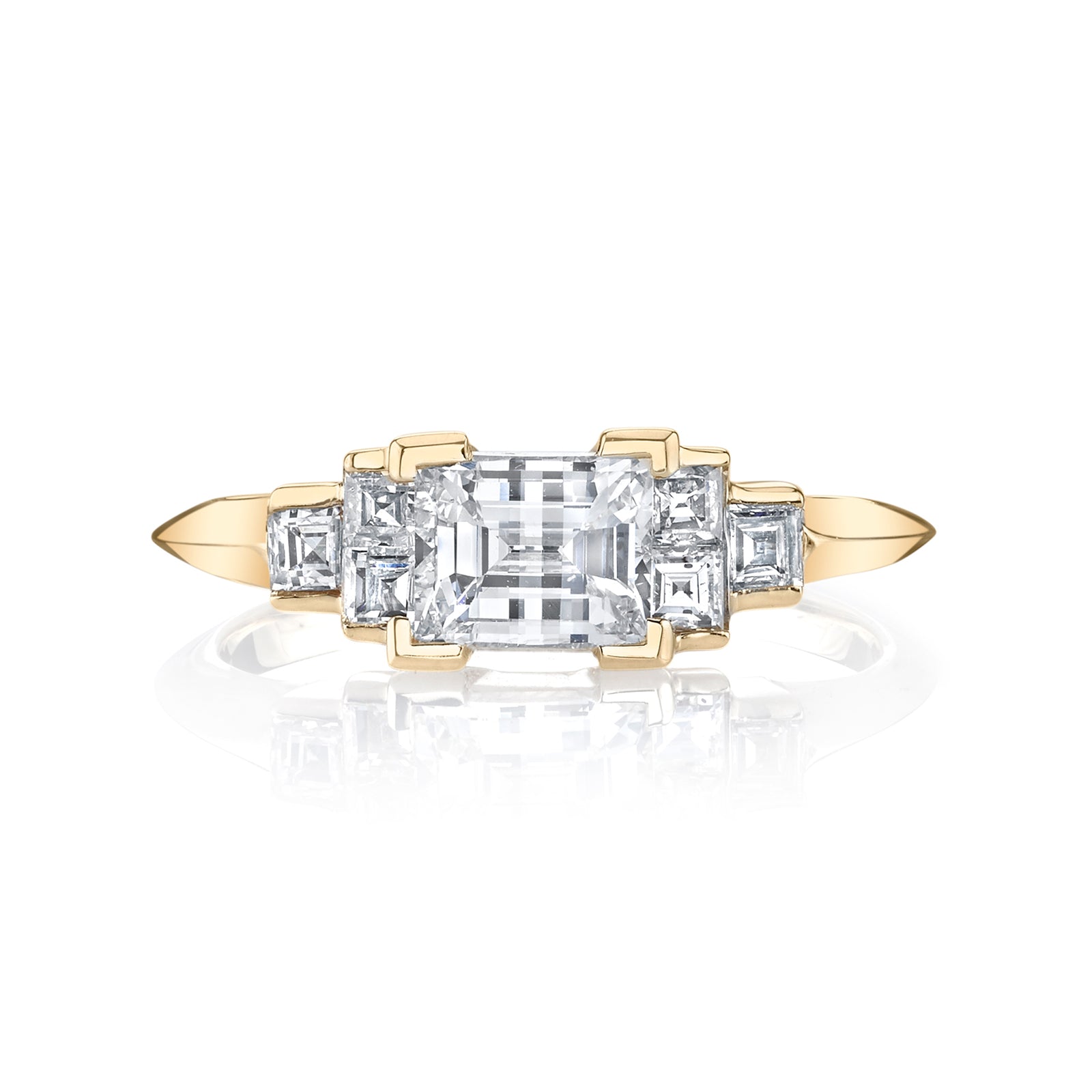 Emerald Cut diamond with Carre Diamond Side Stones with Knife Edge Band