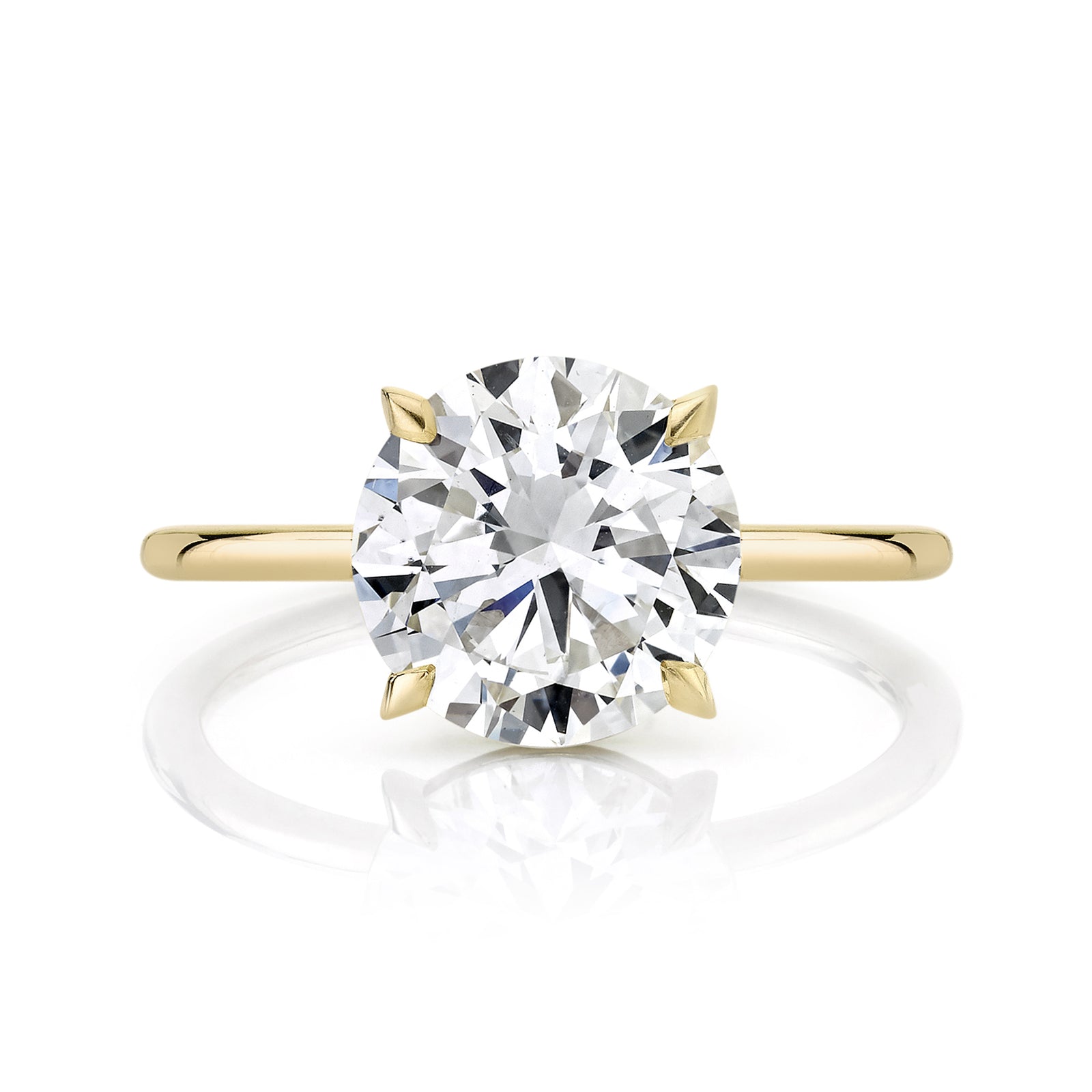 Round Diamond on a Yellow Gold Thin Band and Knife Edge Prongs